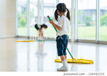Girl cleaning the gym Girl cleaning the gym 126382255