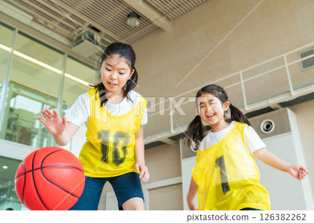 Children playing basketball in the gym 126382262