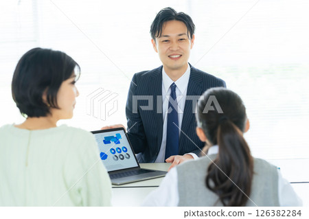 Parent and child having a three-way interview 126382284
