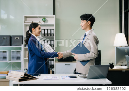 Business people shaking hands during a meeting. Two happy businessmen Business people shaking hands during a meeting. Two happy businessmen 126382302
