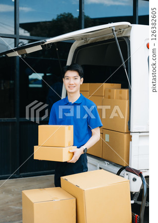 Asian courier delivery man searching the address on digital tablet.  near van outside the warehouse. This is a freight transportation 126382605