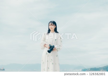 The moment you release the shutter, along with a serene landscape 126382801