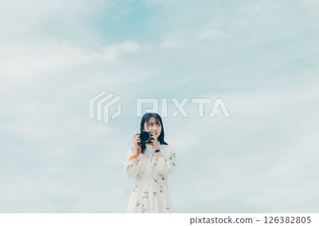 The moment you release the shutter, along with a serene landscape 126382805