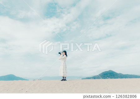 The moment you release the shutter, along with a serene landscape 126382806