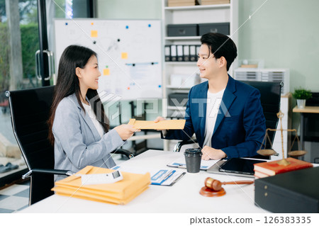Asian business team and lawyers discussing contract papers sitting at the table. Concepts of law, Asian business team and lawyers discussing contract papers sitting at the table. Concepts of law, 126383335
