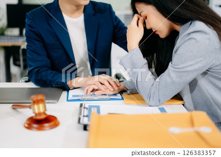 Judge gavel with scales of justice, Business and lawyer or counselor consulting and discussing contract papers Judge gavel with scales of justice, Business and lawyer or counselor consulting and discussing contract papers 126383357