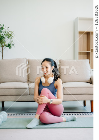 Asian Woman Doing Yoga and Watching Online Tutorials on tablet, Training Asian Woman Doing Yoga and Watching Online Tutorials on tablet, Training 126383626