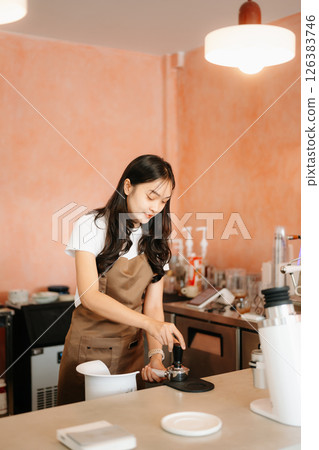 Explore professional Asian baristas brewing coffee, using notepads, digital tablets, and showcasing coffee 126383746