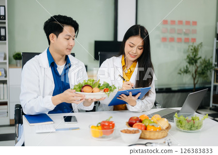 Nutritionists consulting on healthy food choices, meal planning, and wellness concepts 126383833