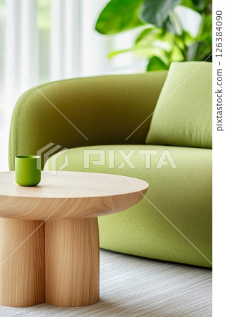 Modern cozy breakout lounge area with green sofa and wooden table. 126384090