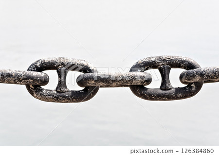 Rusted steel chain on a white background. Links Rusted steel chain on a white background. Links 126384860