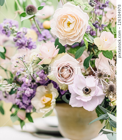 Outdoor wedding buffet table with lavender and a variety of dishes. 126384978