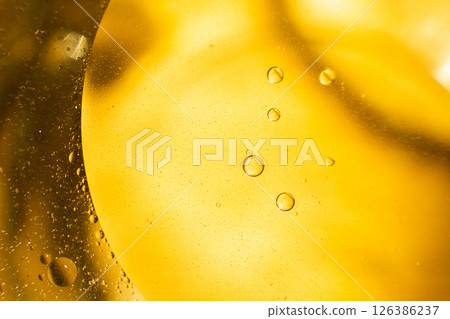 Gold Oil bubbles. circles of orange water macro. abstract yellow background Gold Oil bubbles. circles of orange water macro. abstract yellow background 126386237