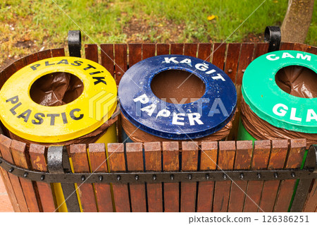Containers for different types of the garbage outdoor for glass, plastic and paper trash 126386251