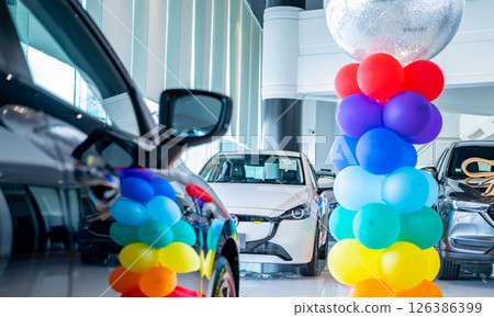 Car parked in luxury showroom. Car dealership office. Car showroom business. New car parked in modern showroom. Auto for sale and rent business. Automobile leasing and insurance. Electric automobile. Car parked in luxury showroom. Car dealership office. Car showroom business. New car parked in modern showroom. Auto for sale and rent business. Automobile leasing and insurance. Electric automobile. 126386399