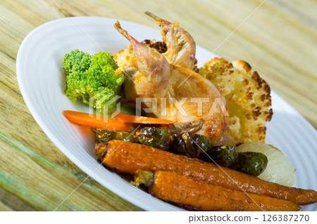 Partridge with vegetables in honey-mustard sauce 126387270