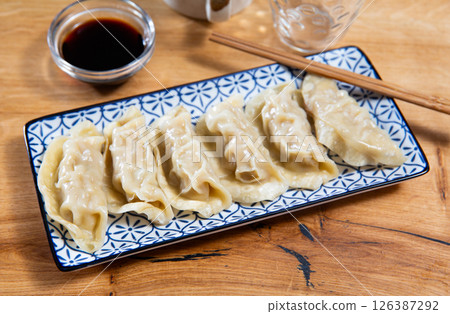 Japanese gyoza dumplings served on platter 126387292