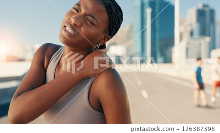 Woman, fitness or shoulder pain with injury in city street for muscle tension, sprain or pressure. Active, female person or runner with sore arm or neck ache for medical emergency, accident or bruise 126387398