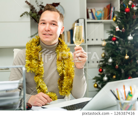 Smiling man office manager celebrating New Year Smiling man office manager celebrating New Year 126387416