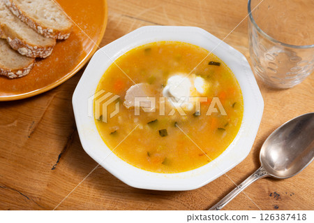 Rassolnik with sour pickles and pearl barley 126387418