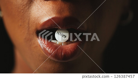 Mouth, tablet and addiction in studio closeup with text for mind altering drugs by black background. Person, pills and illegal medicine with opioid crisis, mood and happy word with chemical compound Mouth, tablet and addiction in studio closeup with text for mind altering drugs by black background. Person, pills and illegal medicine with opioid crisis, mood and happy word with chemical compound 126387457