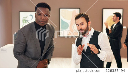 Creative, men and exhibition with discussion in art gallery for negotiation, talk and explain deal. People, portrait and customer with museum, guide and display with culture, talent or pov at event 126387494