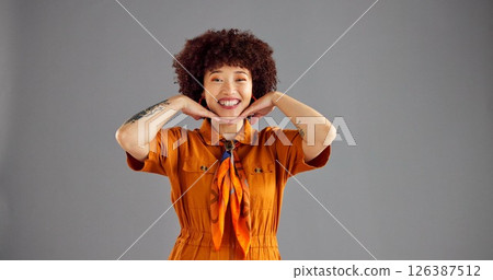 Happy, fashion and portrait of woman in studio with color, stylish and trendy clothing with confidence. Smile, mockup space and female person from Colombia with cool outfit by gray background. 126387512