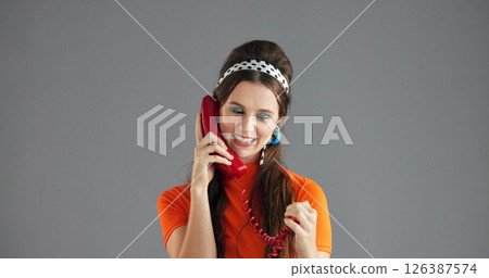 Telephone, retro fashion or happy woman in studio talking with trendy clothes, mockup space and smile. Makeup, girl and model with phone call for chat, vintage style and gossip on grey background Telephone, retro fashion or happy woman in studio talking with trendy clothes, mockup space and smile. Makeup, girl and model with phone call for chat, vintage style and gossip on grey background 126387574