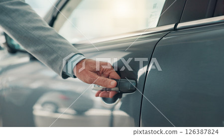 Car, door and hand of salesman at dealership for advice, consulting or negotiation of vehicle purchase. Insurance, retail and showroom with automobile representative at work for luxury rental 126387824