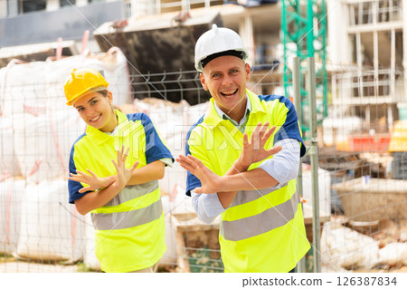 Builders dancing in construction site Builders dancing in construction site 126387834