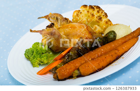 Roasted quail with baked vegetables Roasted quail with baked vegetables 126387933