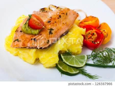 Grilled fillet of trout with potato mash and vegetables 126387966