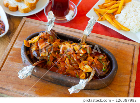 Festive table with lamb chop casserole Festive table with lamb chop casserole 126387982