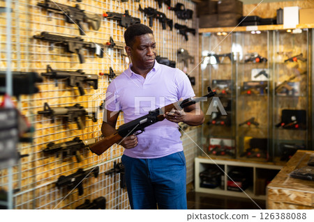 African-american man in weapon shop 126388088