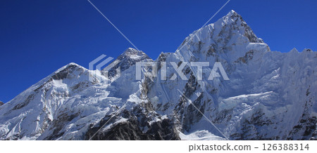Panoramic image of Mount Everest and Nuptse on a clear day. 126388314