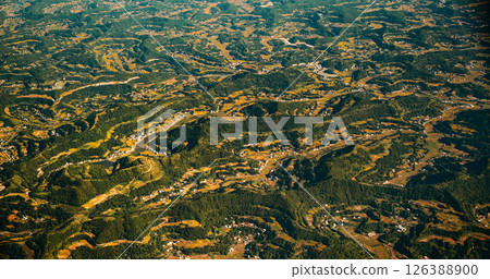 View From Airplane Window On Private Buildings, China. Mountainous Wooded Terrain Landscape Of China. Porthole View Or Called Bull's-eye Window. Discover China View From Airplane Window On Private Buildings, China. Mountainous Wooded Terrain Landscape Of China. Porthole View Or Called Bull's-eye Window. Discover China 126388900