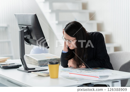 A female construction company employee looking troubled 126388909