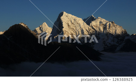 Bright lit peaks of Ama Dablam, Cholatse, Taboche and Tobuche seen from Gokyo Valley, Nepal. 126388925
