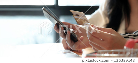 woman asian making online payment on laptop computer with credit card for shopping on onlines retail shop at home 126389148