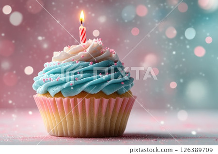 Colorful cupcake with blue frosting and a candle on top, perfect for celebrations and birthdays 126389709