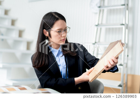 A female architect and interior designer choosing building materials 126389903