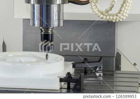 The CNC milling machine finish cut the nylon parts with solid ball nose end mill tool. 126389951
