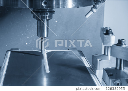 The CNC milling machine finish cut the aluminum housing parts with flat nose end mill tool in the light blue scene. 126389955