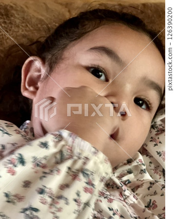 Portrait of a beautiful girl with a white shirt Portrait of a beautiful girl with a white shirt 126390200