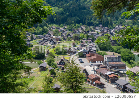 Traditional thatched houses of Shirakawa-go village in rural Japan. Panoramic view Traditional thatched houses of Shirakawa-go village in rural Japan. Panoramic view 126390657