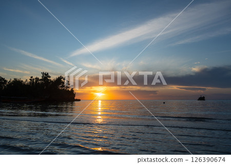 Sunset on Lia beach, Waleakodi Island, Togian archipelago, Sulawesi, Indonesia 126390674