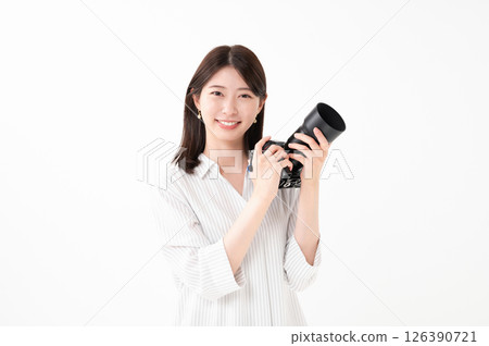 A woman with a camera 126390721