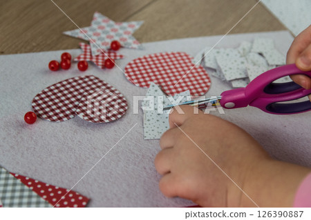 The hand of the child make greeting card with heart. Hobby concept. Handmade. 126390887