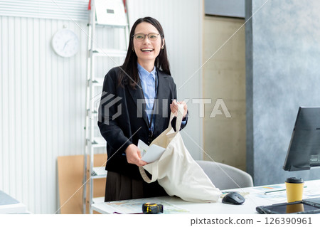 A female employee of a construction company preparing to depart 126390961