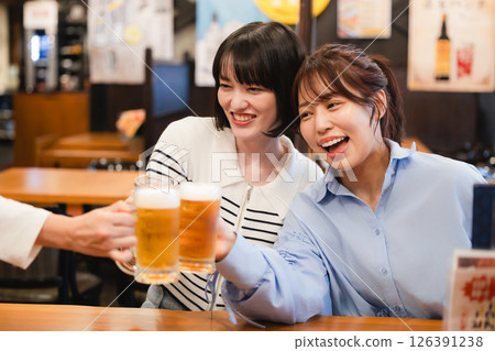 Women toasting at an izakaya 126391238
